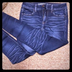 Dark washed jeans with fade on knees